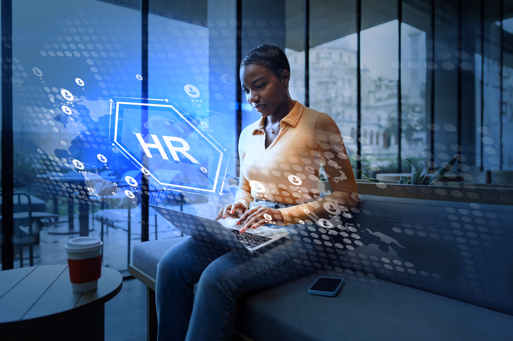 Professional with an HR technology hologram overlay